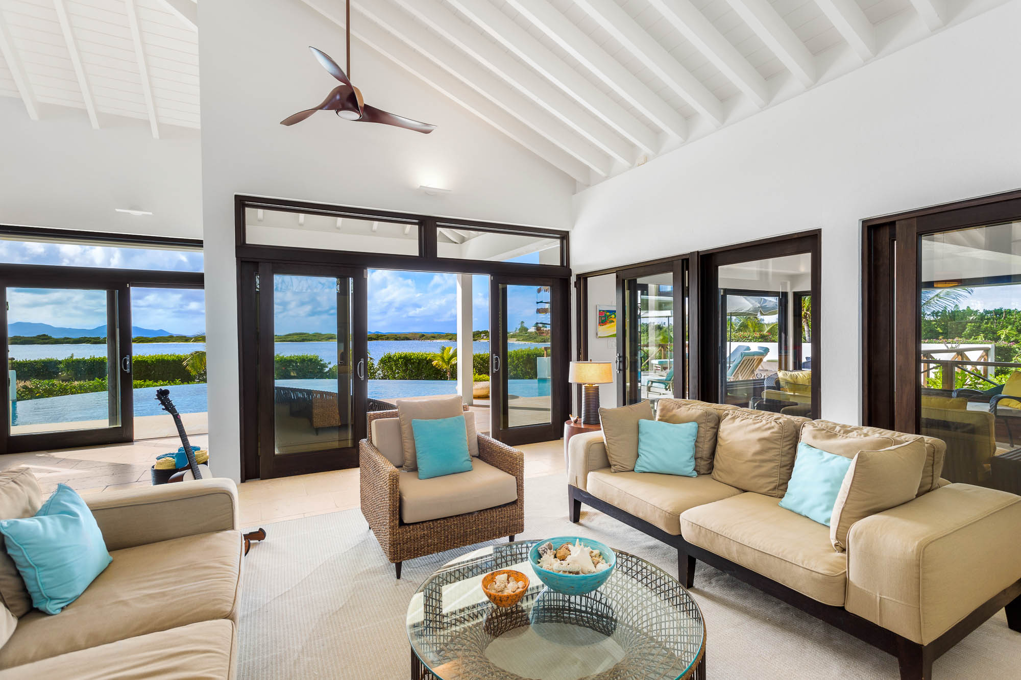 Bright living area with pool views